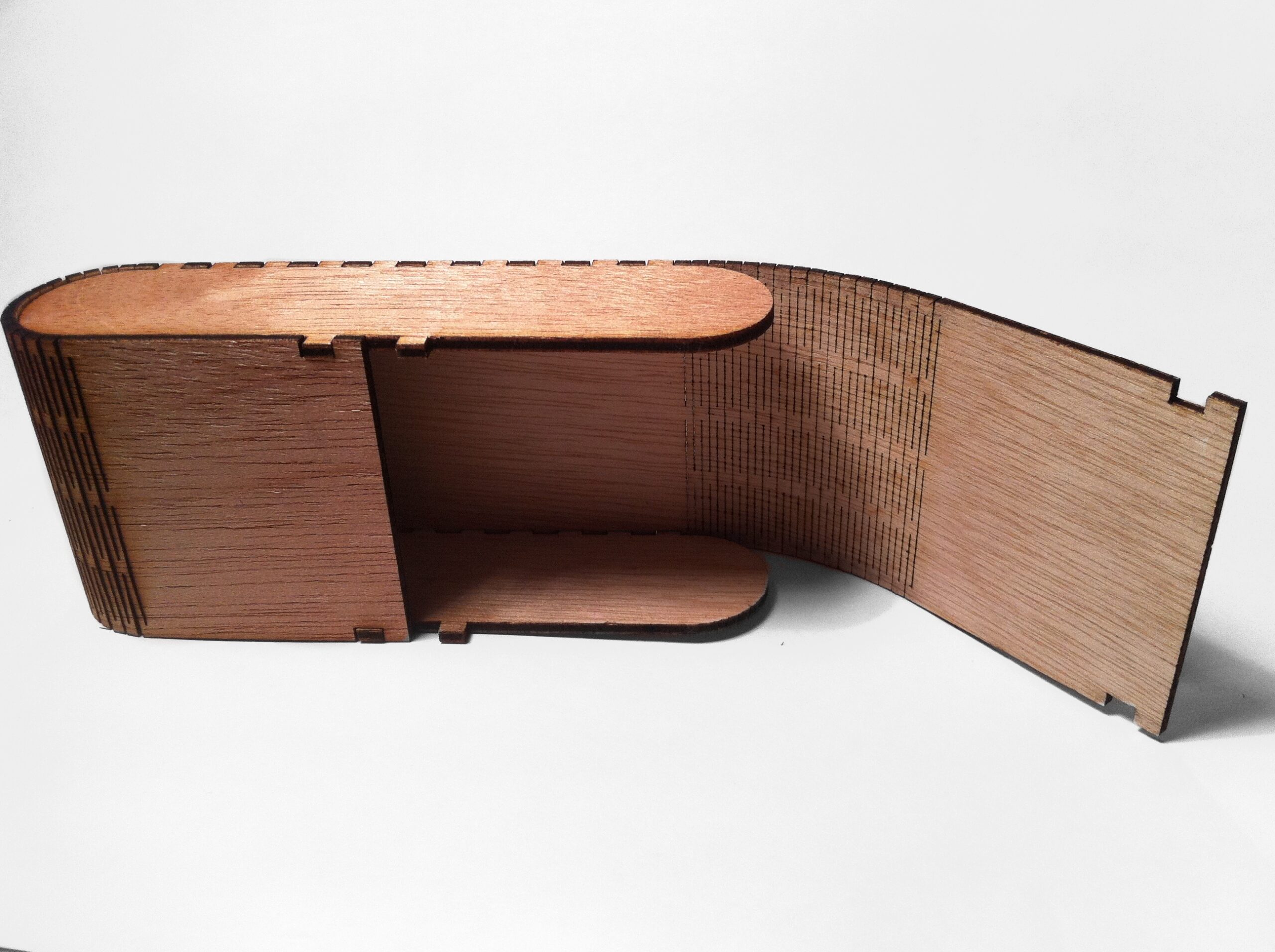 Plywood box with a laser-cut living hinge, showing assembled wood parts after the cut