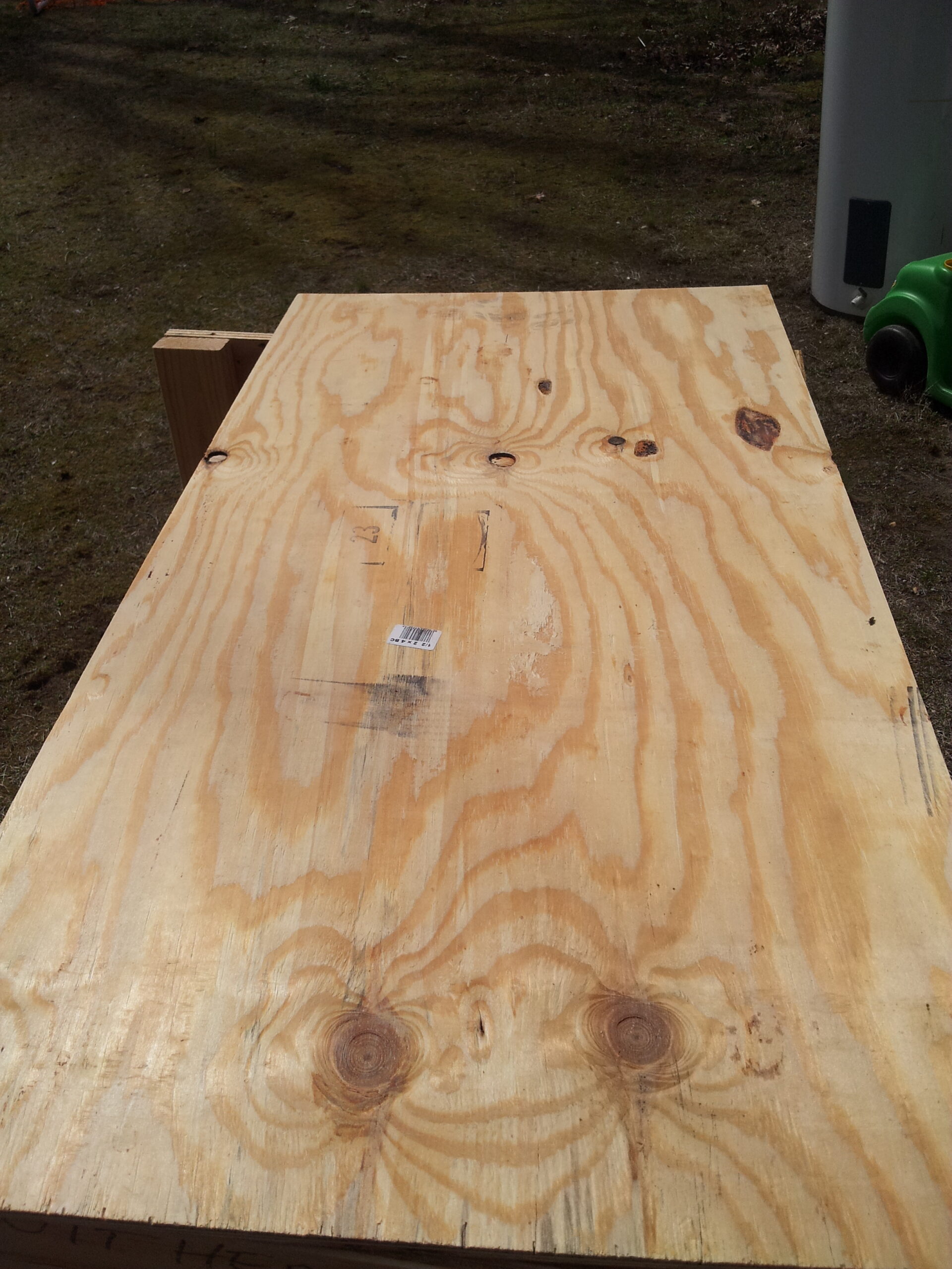 A rectangular leftover piece of plywood large enough to cut another part