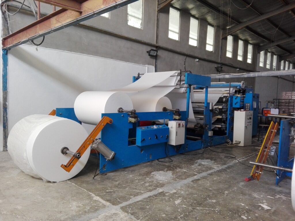 Jumbo tissue parent roll staged on a converting machine